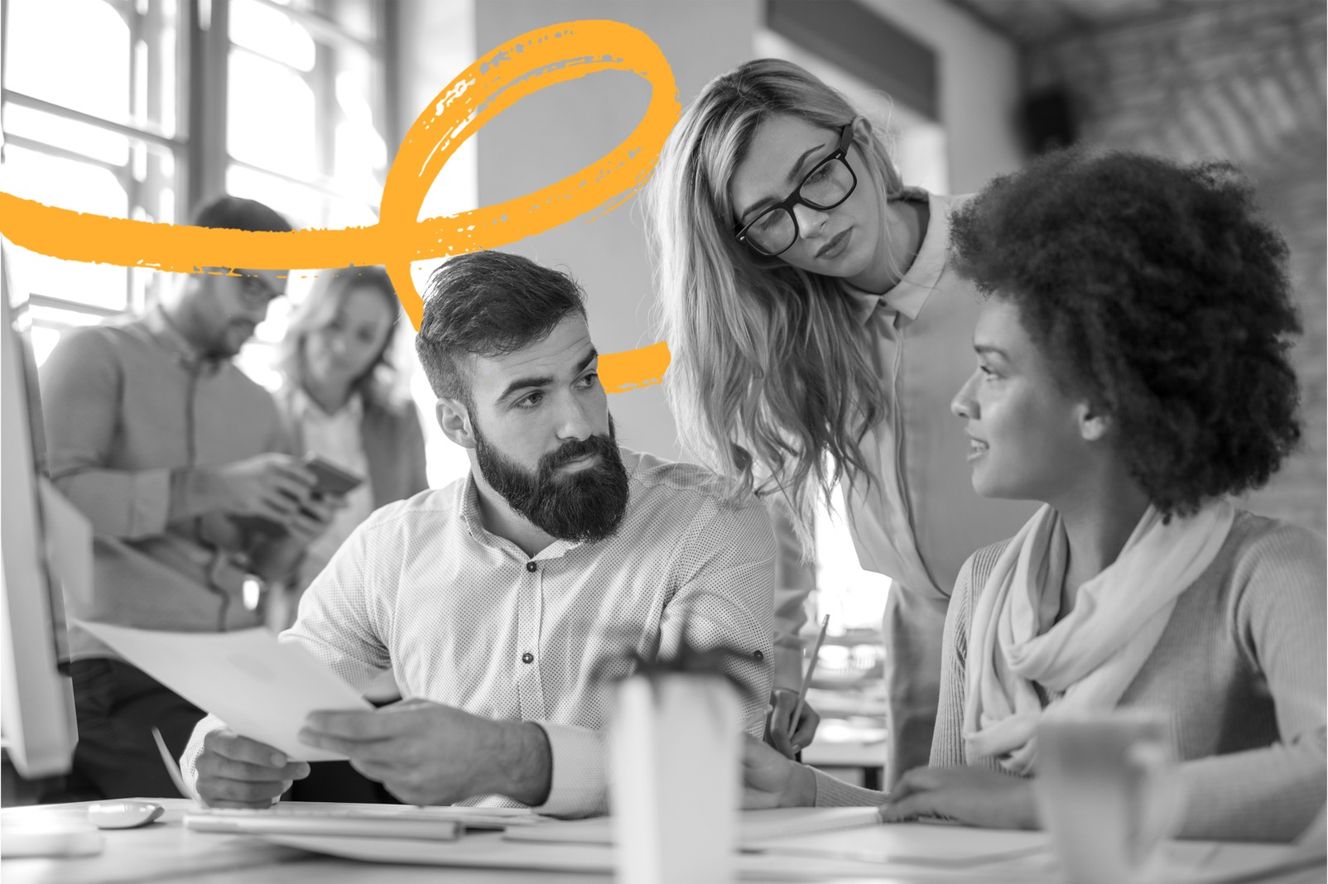 Small business coworkers collaborating at office table